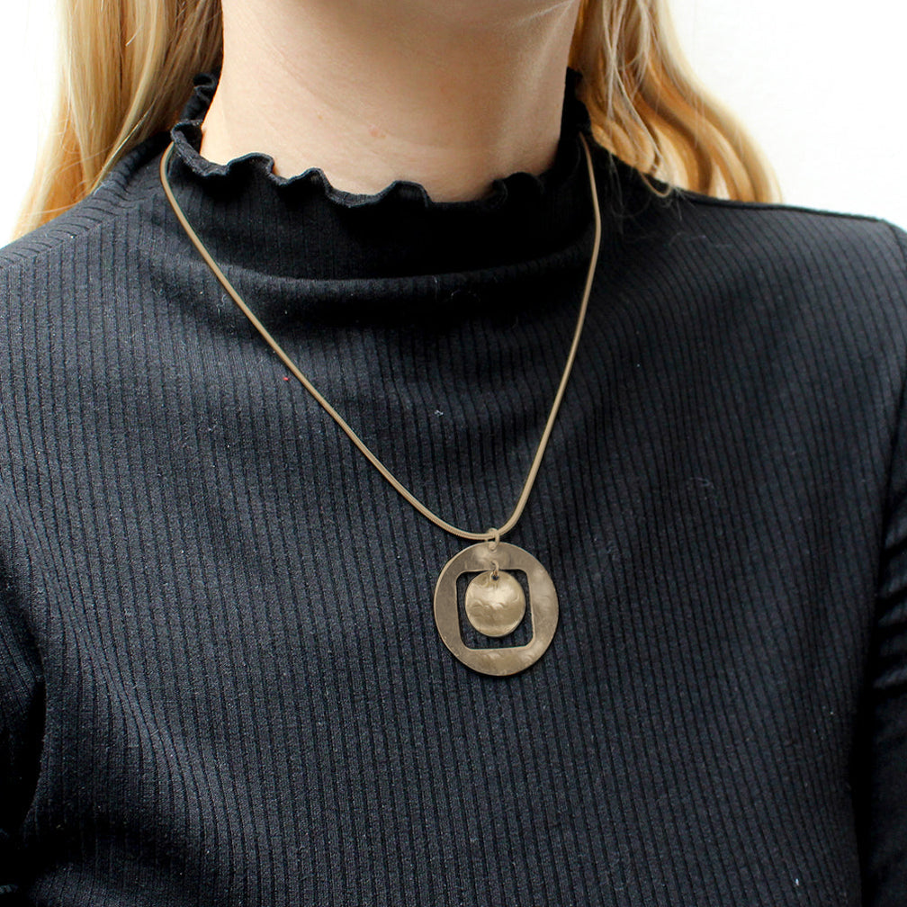 Marjorie Baer Necklace: Cutout Disc with Hanging Disc, Brass